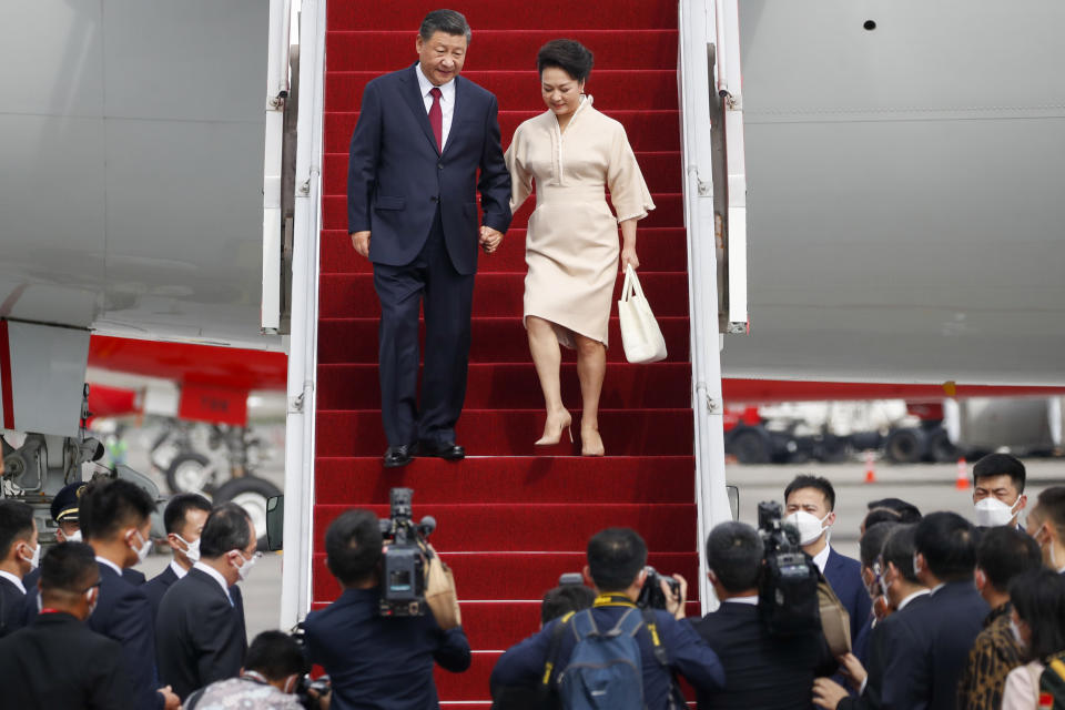 Chinese President Xi Jinping and his wife Peng Liyuan disembark their plane upon arrival at Ngurah Rai International Airport ahead of the G20 Summit in Bali, Indonesia, Monday, Nov. 14, 2022. (Ajeng Dinar Ulfiana/Pool Photo via AP)