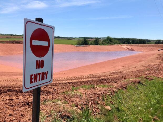 Holding ponds like this one in Shamrock, P.E.I., were at the centre of a debate in the legislature Friday. (Steve Bruce/CBC - image credit)