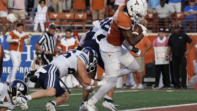 Texas wide receiver Adonai Mitchell, right, runs for a touchdown against BYU during the second half of an NCAA college football game in Austin, Texas, Saturday, Oct. 28, 2023. (AP Photo/Eric Gay)