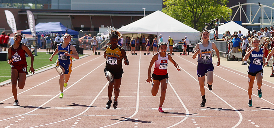 Shawnteah La Croix of Aberdeen Christian (1927), Chloe Raw of Arlington (1949) and Adison Moore of Iroquois-Lake Preston (2167) are pictured during the finals of the Class B girls' 100-meter dash in the 2024 South Dakota State Track and Field Championships at Howard Wood Field in Sioux Falls.