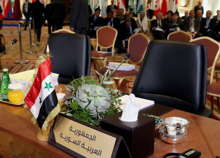 The empty seat of Syria is seen during a pre Arab Economic and Social Development summit meeting in Beirut, Lebanon January 18, 2019. REUTERS/Mohamed Azakir