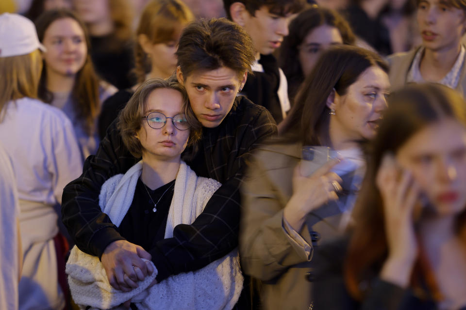 School graduates wait for a show on the Neva River during the Scarlet Sails festivities marking school graduation in St. Petersburg, Russia, early Saturday, June 25, 2022. (AP Photo/Elena Ignatyeva)