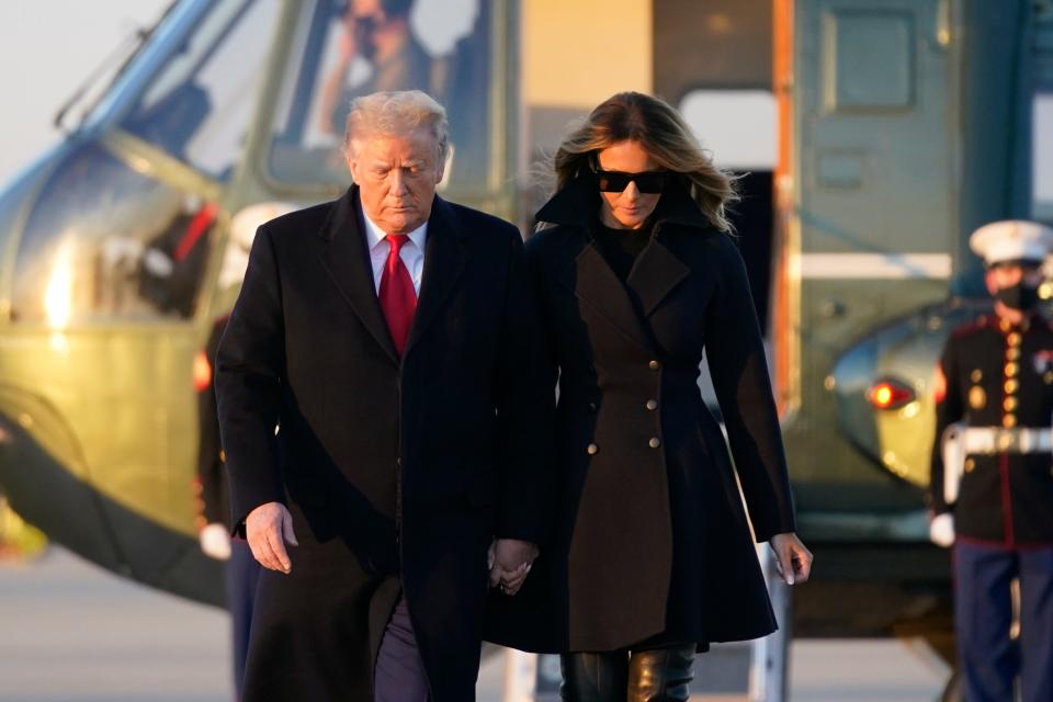 President Donald Trump and first lady Melania Trump board Air Force One at Andrews Air Force Base in Maryland on Dec. 23, 2020.