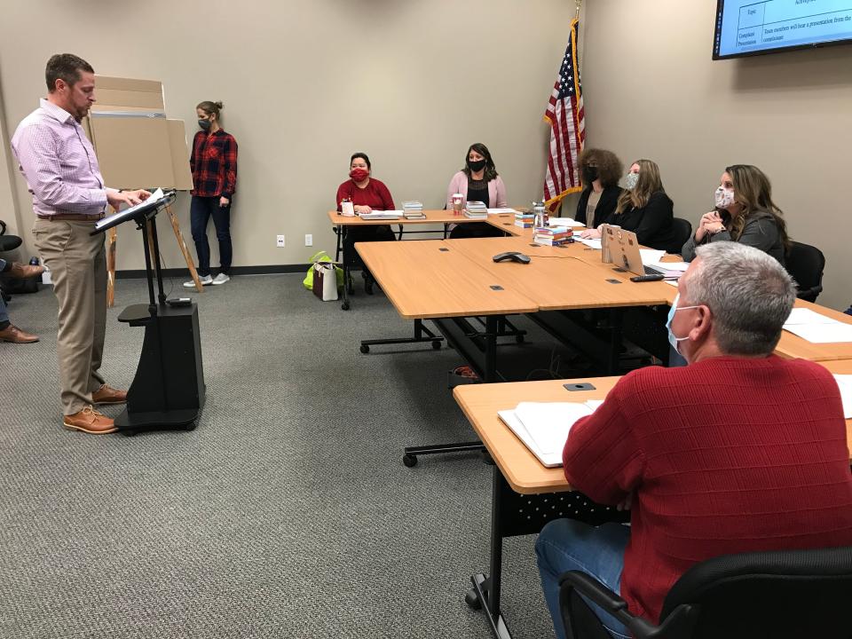 Dennis Murphy describes his complaint about five books in Urbandale middle and high school libraries before the Instructional Materials Reconsideration Committee Monday.