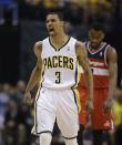 Indiana Pacers' George Hill (3) celebrates during the second half of game 2 of the Eastern Conference semifinal NBA basketball playoff series against the Washington Wizards Wednesday, May 7, 2014, in Indianapolis. Indiana defeated Washington 86-82. (AP Photo/Darron Cummings)