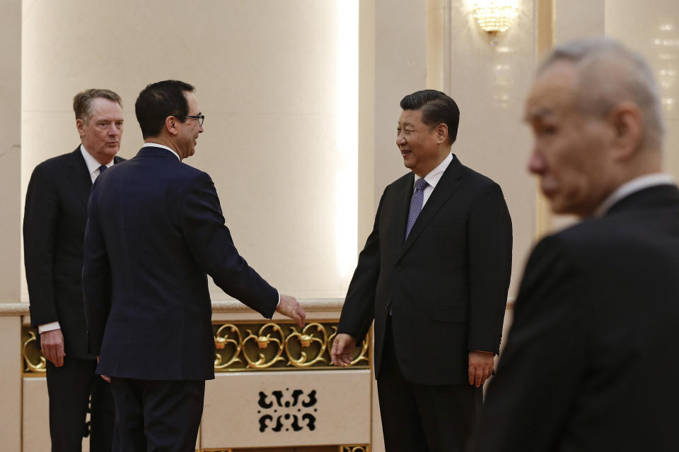 U.S. Treasury Secretary Steven Mnuchin, second from left, talks with Chinese President Xi Jinping as U.S. Trade Representative Robert Lighthizer, left, and Chinese Vice Premier Liu He, right, look on before their meeting at the Great Hall of the People in Beijing, Friday, Feb. 15, 2019. (AP Photo/Andy Wong, Pool)