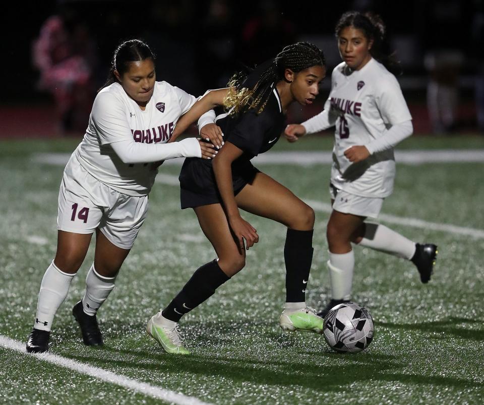 Wahluke's Mariana Contreras (14) tries to take control of the ball from Klahowya's Amira Lyons (17) on Tuesday Nov. 9, 2021.