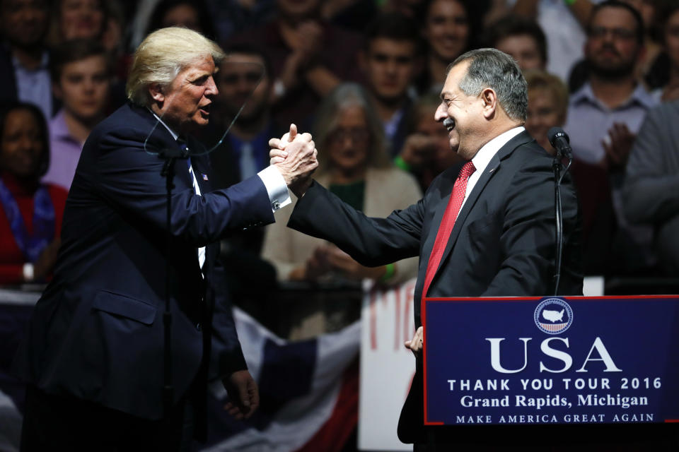 Then-President-elect Donald Trump thanks Dow Chemical CEO Andrew Liveris in December 2016. (Photo: Paul Sancya/AP)