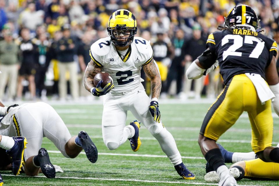 Michigan running back Blake Corum runs against Iowa during the second half of U-M's 26-0 win over Iowa in the Big Ten championship game in Indianapolis on Saturday, Dec. 2, 2023.