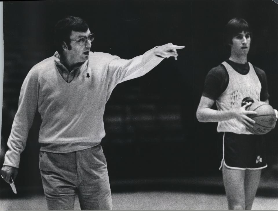 Coach Digger Phelps hollers instructions to his players Friday afternoon during Notre Dame's workout in 1979 at the Milwaukee Arena. At right is Bill Hanzlik, a 6 foot 7 junior starter.