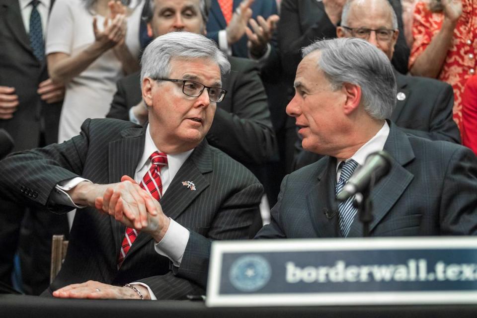 Lieutenant Gov. Dan Patrick, left, shakes hands with Gov. Greg Abbott during a press conference on details of his plan for Texas to build a border wall and provide $250 million in state funds as a “down payment.”, Wednesday, June 16, 2021 in Austin, Texas. (Ricardo B. Brazziell/Austin American-Statesman via AP)