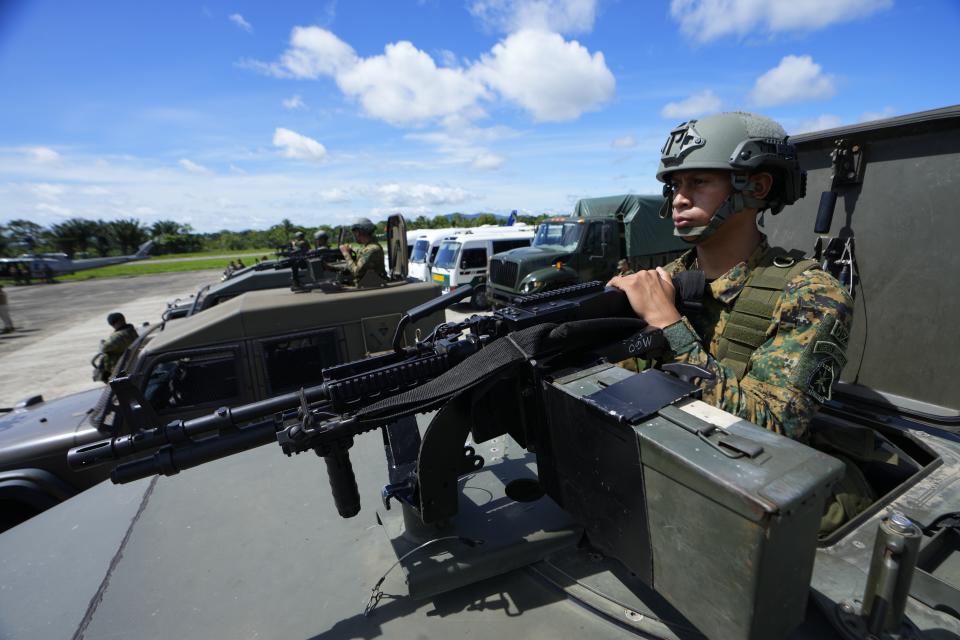 Panamanian border police attend a launch ceremony for Operation Shield in Nicanor, Darien province, Panama, Friday, June 2, 2023. Security officials said Operation Shield is part of the agreement reached with the governments of Colombia and the United States in April to stop the flow of migrants through the border’s jungle-clad mountains known as the Darien Gap. (AP Photo/Arnulfo Franco)