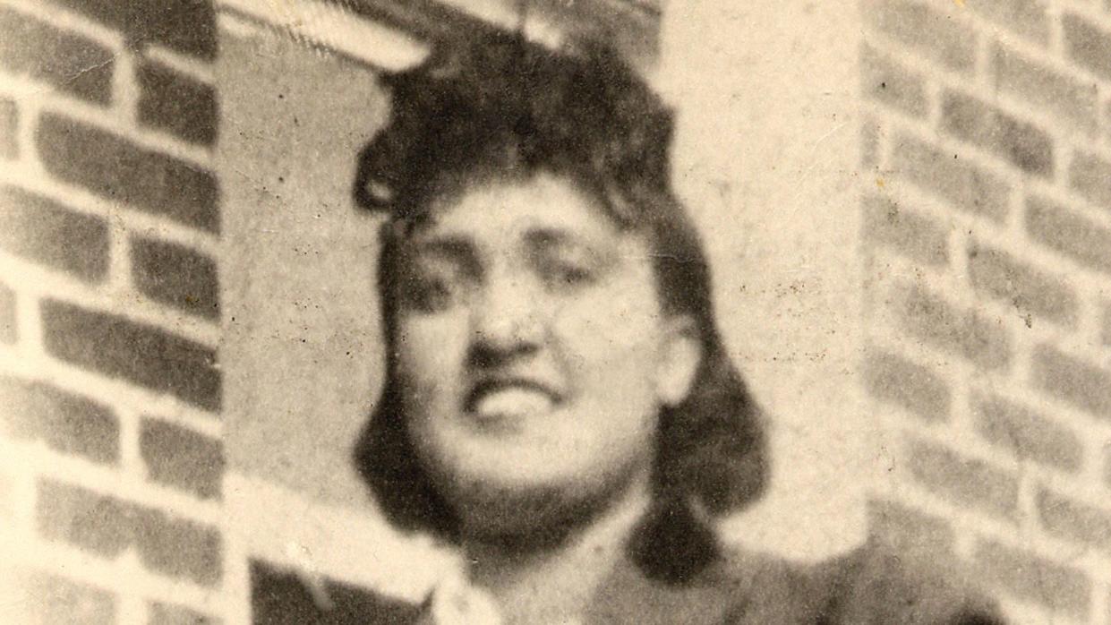 henrietta lacks smiling for a photo with her hands on her hips