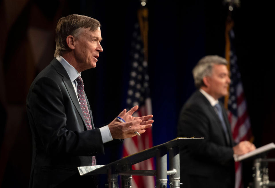 Democratic challenger John Hickenlooper, front, talks during a debate with Republican U.S. Senator Cory Gardner during a debate between the candidates Tuesday, Oct. 13, 2020, in Fort Collins, Colo. (Pool Photo By Bethany Baker/Fort Collins Coloradoan via AP)