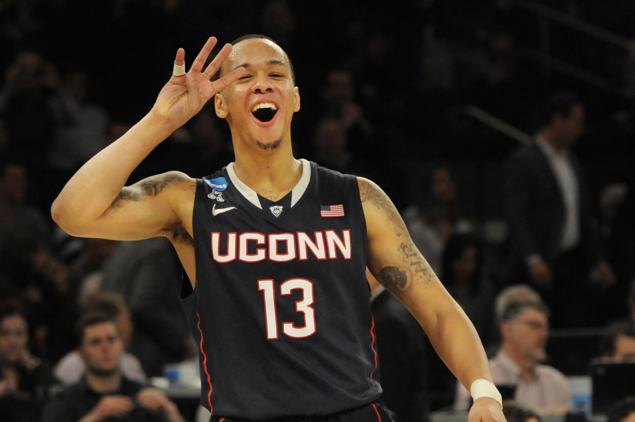 In the closing seconds of the game, Connecticut Huskies guard Shabazz Napier (13) celebrates at the end of the NCAA Tournament's East Regional final. The Connecticut Huskies defeated the Michigan State Spartans, 60-54, at Madison Square Garden in New York on Sunday, March 30, 2014. (Richard Messina/Hartford Courant/Tribune News Service via Getty Images)