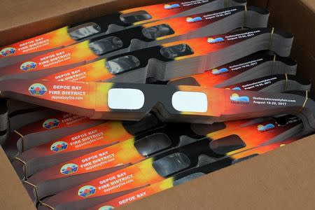 Solar eclipse glasses that will be handed out by the community are pictured in Depoe Bay, Oregon, U.S., August 8, 2017. REUTERS/Jane Ross/Files