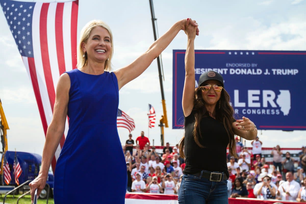 Rep Mary Miller, R-Ill., left, is joined by Rep Lauren Boebert, R-Colo., on stage at a rally. Both Republican candidates won their primaries this week (Bad Wolf Media)