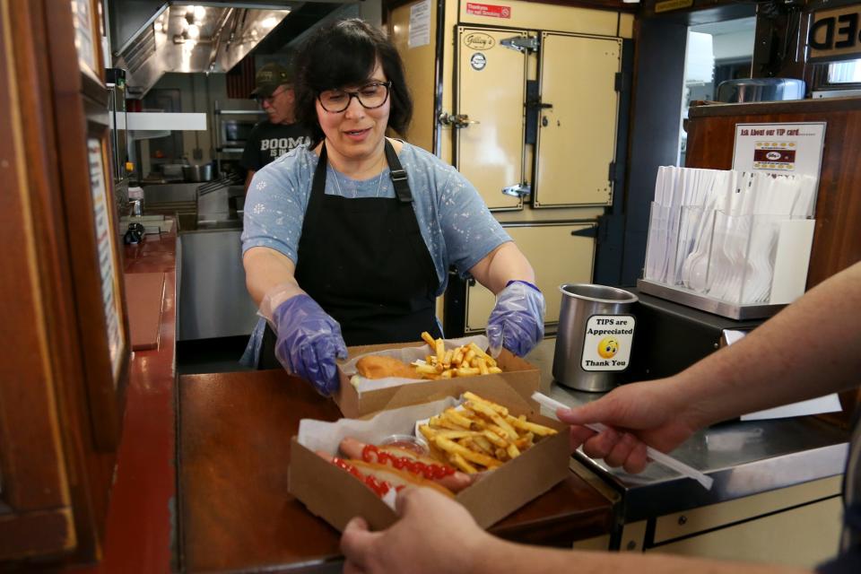 Gina Kennedy, owner of Gilley's Diner, serves customers in Portsmouth on Wednesday, May 25, 2022.