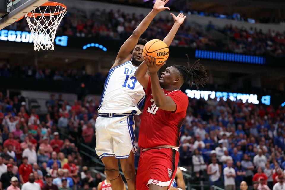 North Carolina State forward DJ Burns Jr. puts up a shot against Duke forward Sean Stewart during their Elite Eight game in Dallas.