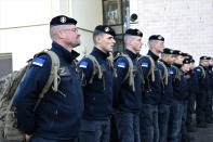 This photo provided Tuesday Feb.7, 2023 by the French Interior Ministry shows rescue workers lining up before boarding a bus for the Charles de Gaulle airport, north of Paris, Monday, Feb.6, 2023 in Nogent-le-Rotrou, central France. Countries around the world dispatched teams to assist in the rescue efforts, and Turkey's disaster management agency said more than 24,400 emergency personnel were now on the ground. But with such a wide swath of territory hit by Monday's earthquake and nearly 6,000 buildings confirmed to have collapsed in Turkey alone, their efforts were spread thin. (Ministere de l'Interieur via AP)