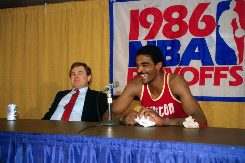 Houston Rockets star Ralph Sampson and coach Bill Fitch talk to reporters during a 1986 NBA playoff series against the Lakers at the Forum.