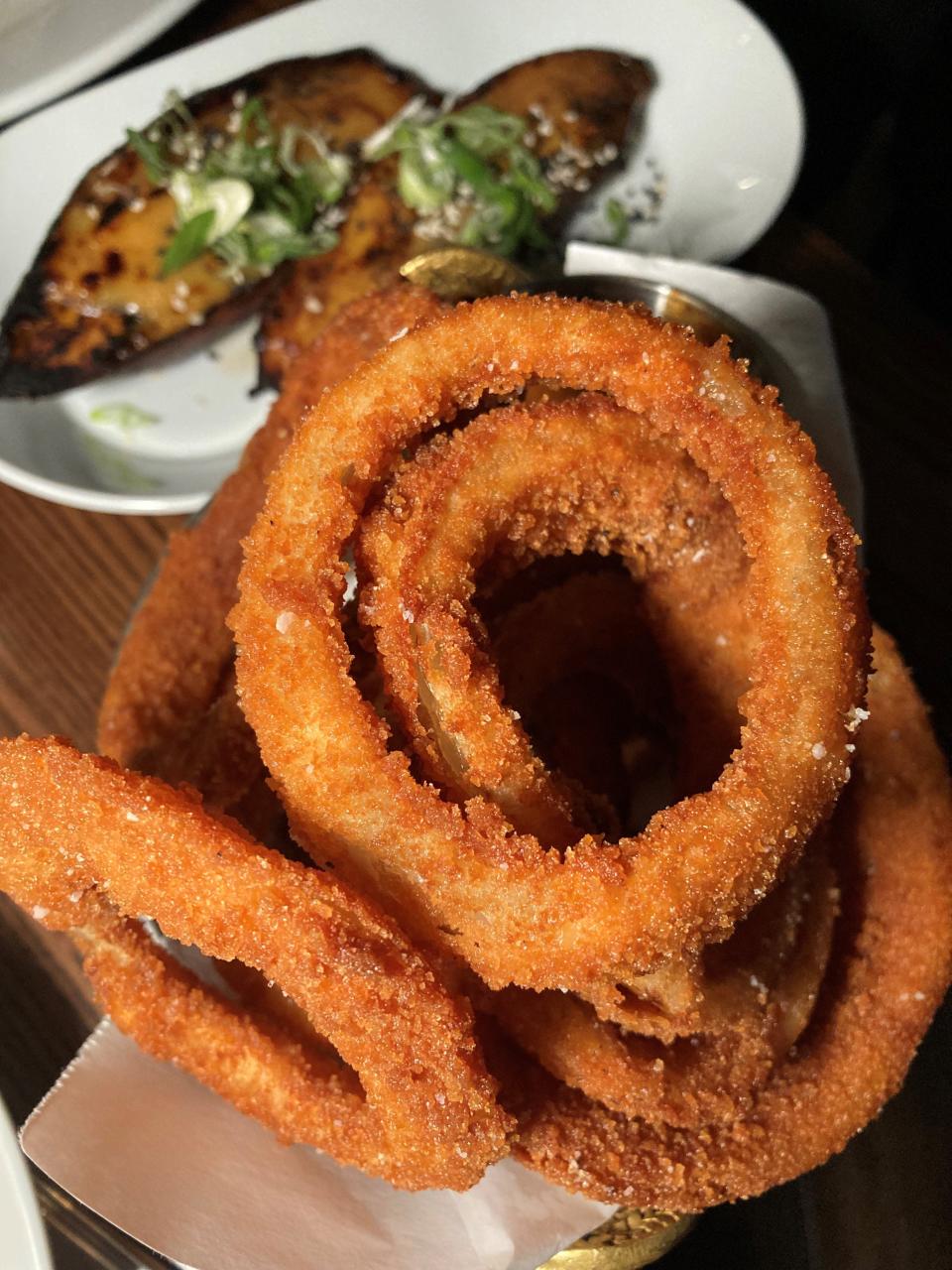 Panko onion rings with, in the back, the best ever miso glazed Korean sweet potato at Roost in Sparkill. Photographed April 23, 2022