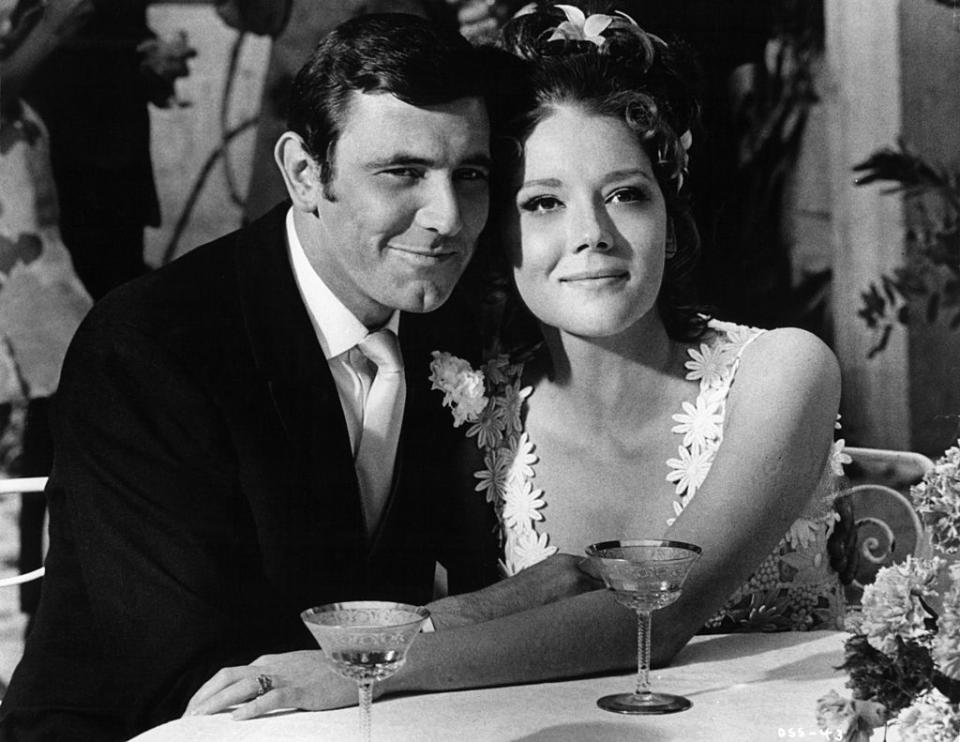 George Lazenby and Diana Rigg as happy newlyweds in a scene from the film 'On Her Majesty's Secret Service'