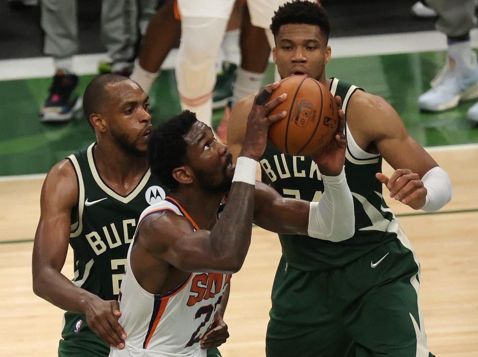 Khris Middleton (left) and Giannis Antetokounmpo (right) have formed a formidable duo for the Bucks on offense as well as defense.