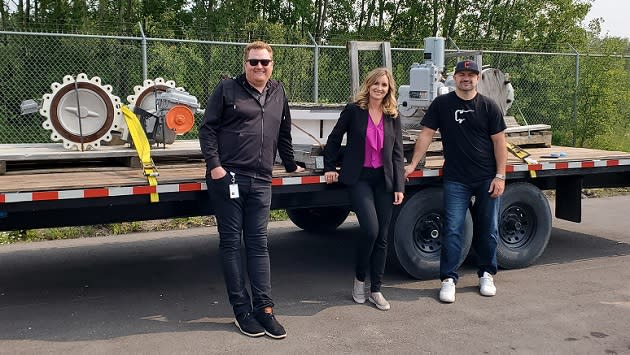 From left, Enbridge's Enbridge Terminal manager Matt McPherson, Pamela Strankman of Enbridge's Supply Chain Management group, and Alexander Valve and Supply President/SEO Ken Braget display some of the 120 suprlus valves donated by Enbridge in August 2023.