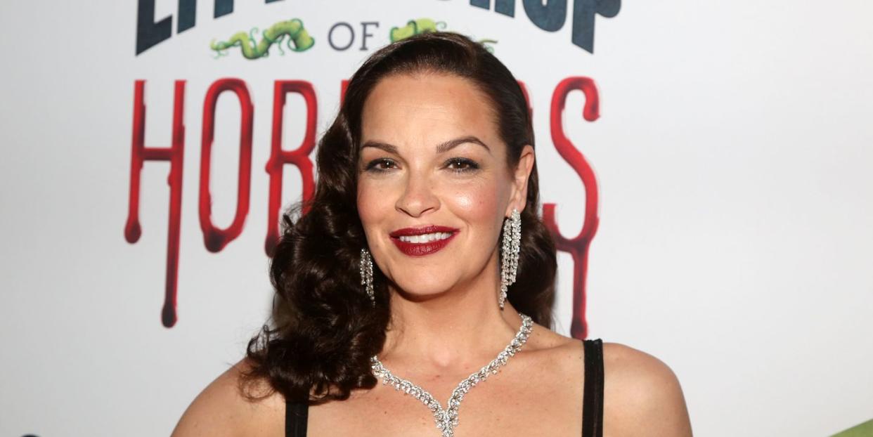 tammy blanchard smiles while attending a red carpet event