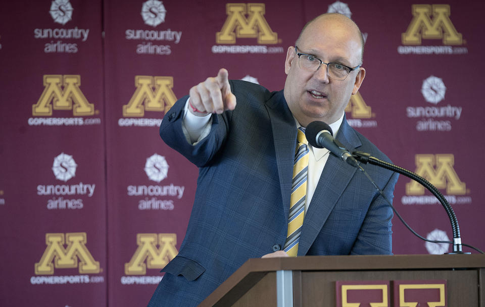 FILE - Bob Motzko, Minnesota men's hockey coach, gestures during an introductory news conference in Minneapolis, in this Thursday, March 29, 2018, file photo. Minnesota's powerhouse men's hockey program hasn't won the national championship in 20 years, but the top-ranked and talent-rich Gophers sure have the team to do it this time. (Elizabeth Flores/Star Tribune via AP, File)