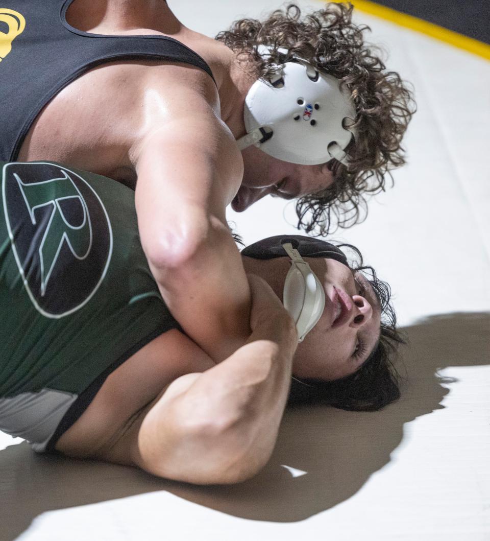 St. John Vianney's Michael Foley (top) is shown pinning Raritan's Kieran Falzon in the 215-pound bout in the Lancers' 41-24 win Wednesday night.