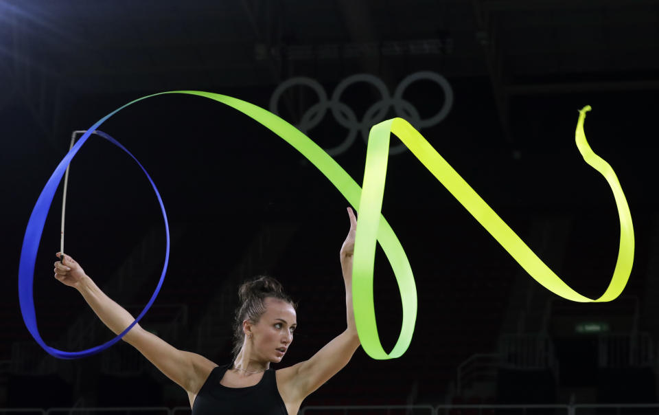 FILE - Ukraine's Ganna Rizatdinova practices her routine a day ahead of the rhythmic gymnastics individual all-around qualifications at the 2016 Summer Olympics in Rio de Janeiro, Brazil, Thursday, Aug. 18, 2016. (AP Photo/Julio Cortez, File)