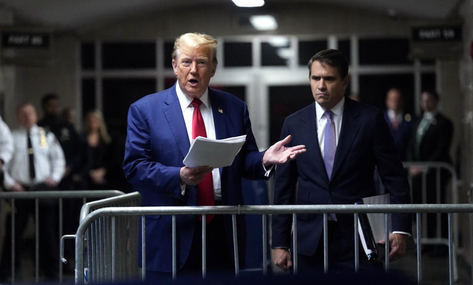 Former President Donald Trump, with attorney Todd Blanche, right, arrives at Manhattan criminal court in New York, on Friday, May 10, 2024. (Timothy A. Clary/Pool Photo via AP)