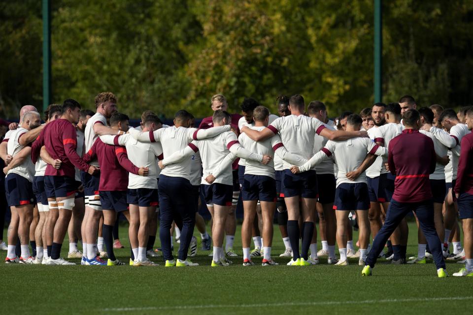 England's players form a huddle during their training session on the outskirts of Paris, France, Tuesday, Oct. 17, 2023. (AP Photo/Themba Hadebe)