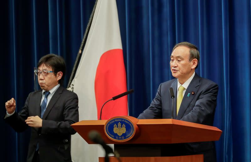 Japanese Prime Minister Yoshihide Suga speaks during a news conference in Tokyo