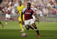 West Ham United forward Michail Antonio (9) moves the ball up the pitch during an English Premier League soccer match against Brentford at London Stadium in London, Sunday, Oct. 3, 2021. (AP Photo/Steve Luciano)