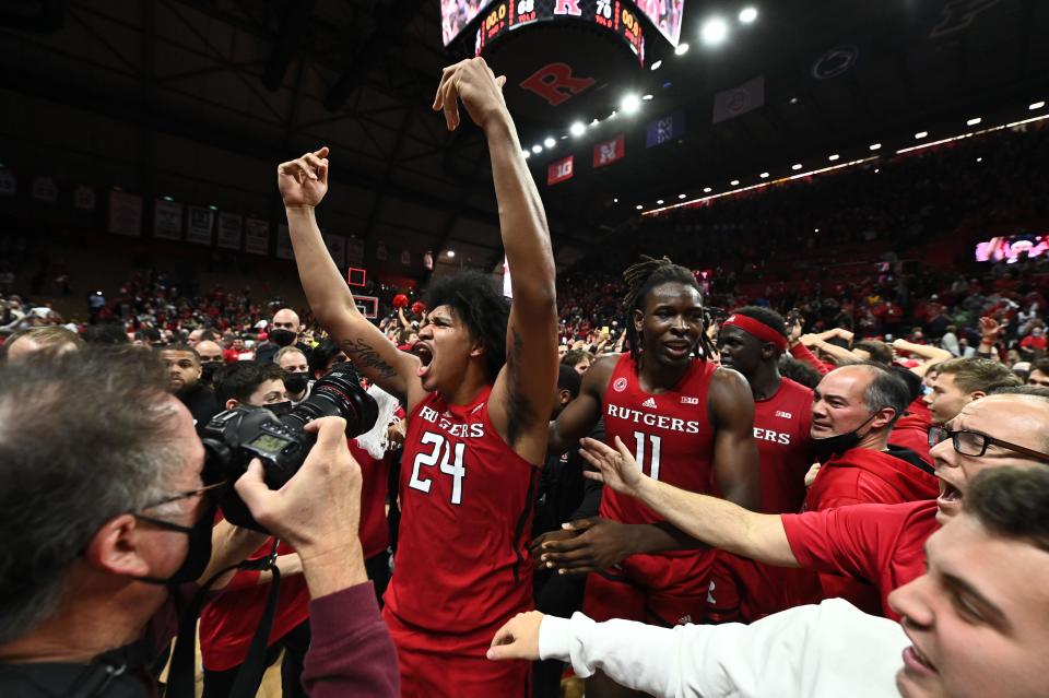 Dec 9, 2021; Piscataway, New Jersey, USA; Rutgers Scarlet Knights guard Ron Harper Jr. (24) celebrates with center Clifford Omoruyi (11) after defeating the top ranked Purdue Boilermakers 70-68 at Jersey Mike's Arena. Mandatory Credit: Catalina Fragoso-USA TODAY Sports