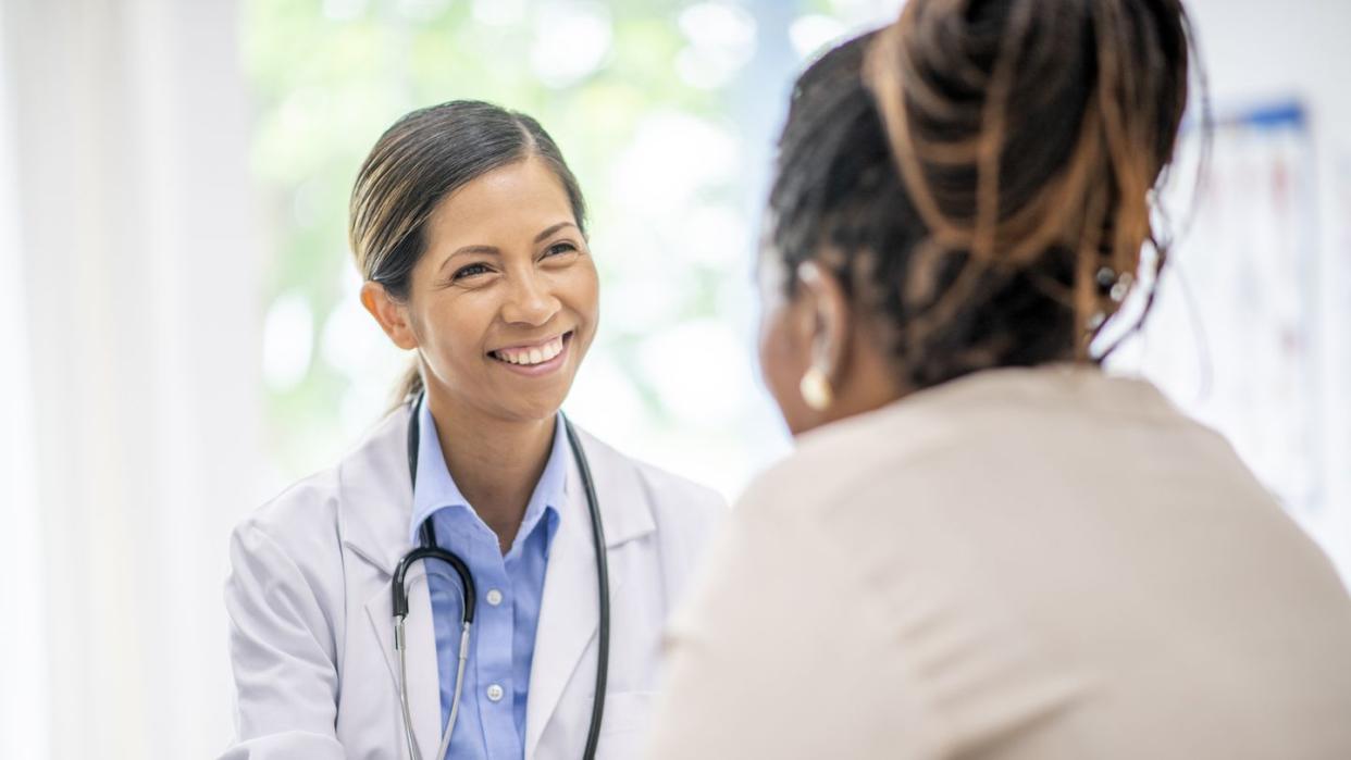 older woman in medical consultation with her doctor