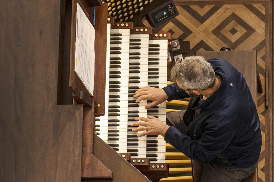 The Hazel Wright organ is tuned at Christ Cathedral in Garden Grove, Calif., Tuesday, Feb. 15, 2022. About nine years ago, the organ was removed piece by piece and shipped to Padua, Italy, for extensive repairs. (AP Photo/Damian Dovarganes)