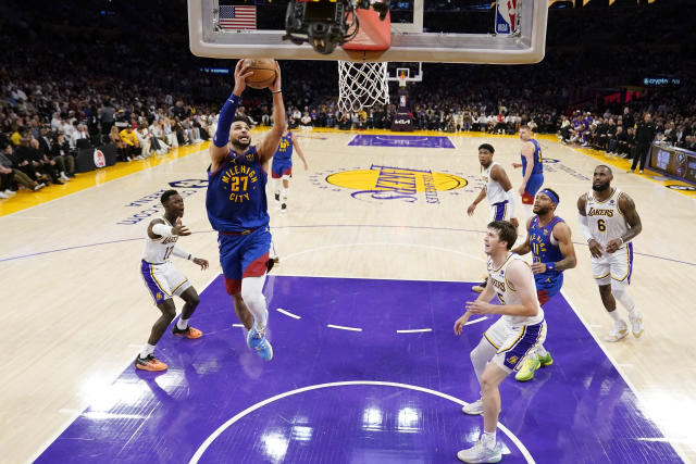 Denver Nuggets guard Jamal Murray (27) drives to the basket against the Los Angeles Lakers in the first half of Game 3 of the NBA basketball Western Conference Final series Saturday, May 20, 2023, in Los Angeles. (AP Photo/Ashley Landis)