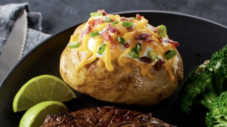 Loaded baked potato on plate