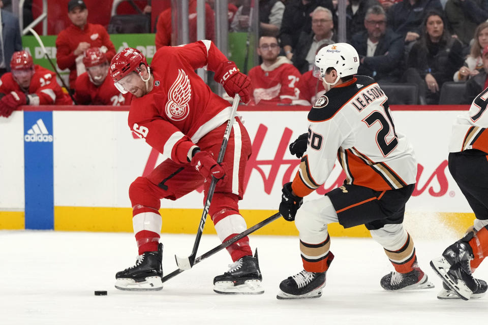 Detroit Red Wings defenseman Jeff Petry (46) controls the puck nez to Anaheim Ducks right wing Brett Leason (20) during the second period of an NHL hockey game, Monday, Dec. 18, 2023, in Detroit. (AP Photo/Carlos Osorio)