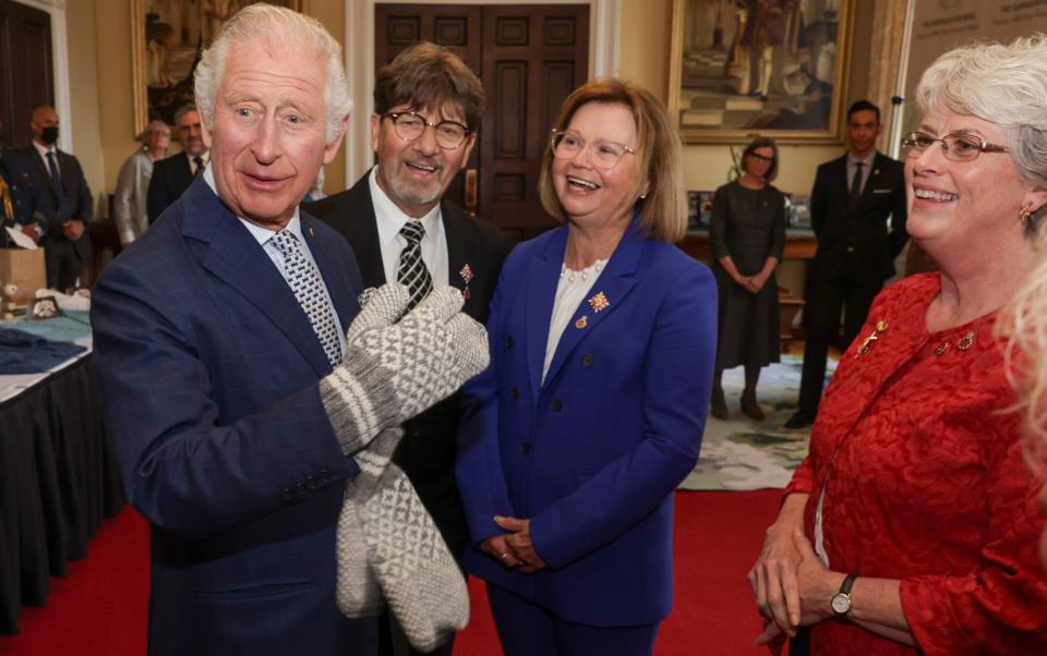 Prince Charles tries on gloves - Chris Jackson/Getty Images