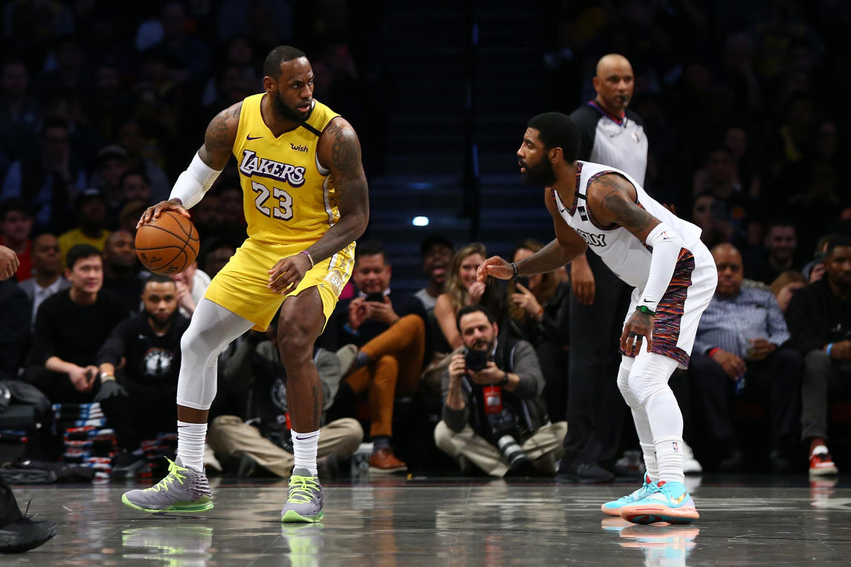 Los Angeles Lakers superstar LeBron James wanted the team to trade for Kyrie Irving, but the Dallas Mavericks outbid the Lakers for the eight-time All-Star's services. (Mike Stobe/Getty Images)