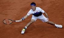 Kei Nishikori of Japan returns the ball to Jo-Wilfried Tsonga of France during their men's quarter-final match during the French Open tennis tournament at the Roland Garros stadium in Paris, France, June 2, 2015. REUTERS/Jean-Paul Pelissier