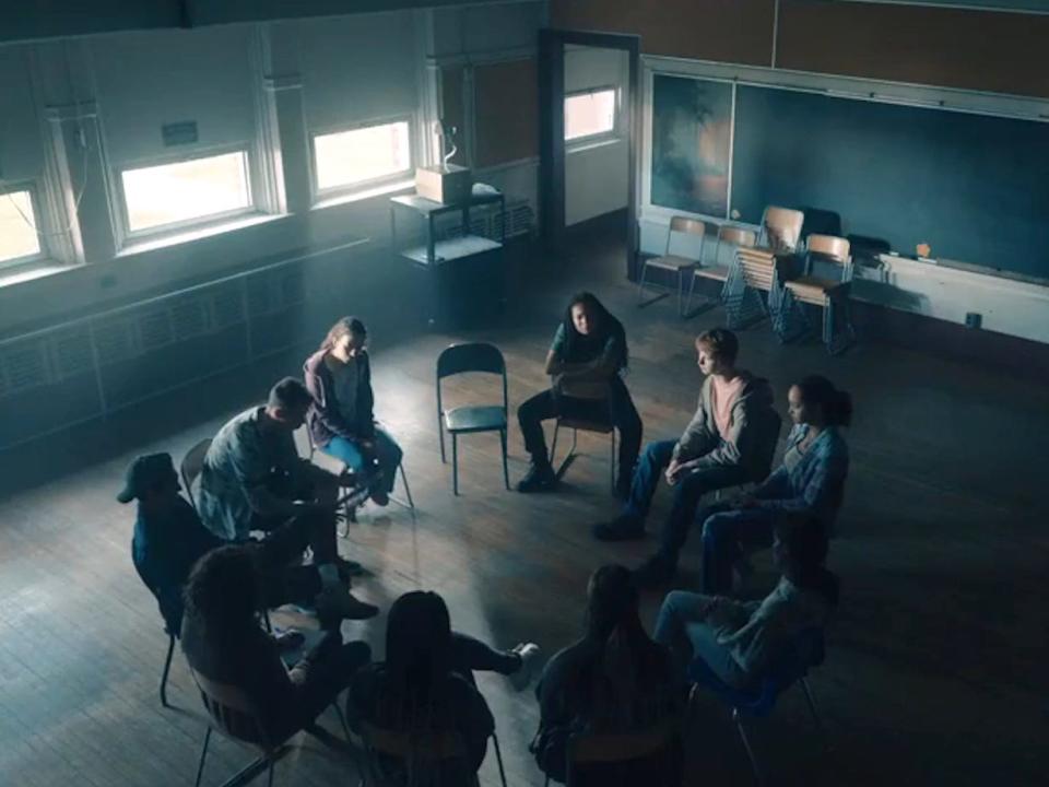 A group of people sitting in a circle at the Red River Institute on season one, episode one of "Gen V."