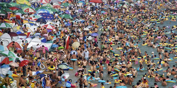<b>Fujiazhuang Beach - Dalian, China </b> Holding the title of China’s most crowded beach, Fujiazhuang is standing room only for the first 10 metres or so from the waters edge. Though incredibly beautiful, you may have a hard time actually seeing the beach with the number of people who frequent it. Oh, and we should probably mention that there is only one toilet block serving 10,000 people, so you can guess what you’re swimming in…