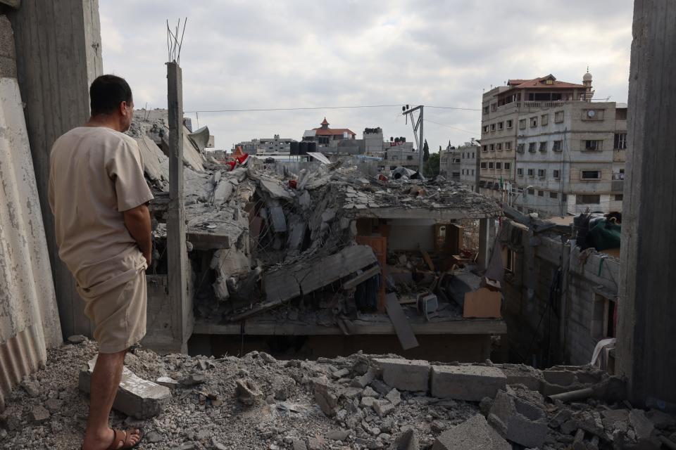 TOPSHOT - A Palestinian looks at the damage to buildings after Israeli bombardment in Rafah in the southern Gaza Strip, on April 29, 2024 amid the ongoing conflict between Israel and the Palestinian militant group Hamas. (Photo by AFP) (Photo by -/AFP via Getty Images) ORIG FILE ID: 2150161328