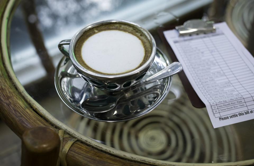 coffee table with a cup of cappuccino